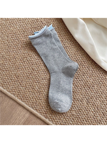 Rufia casual roll cuff crew socks folded neatly with visible cuff roll