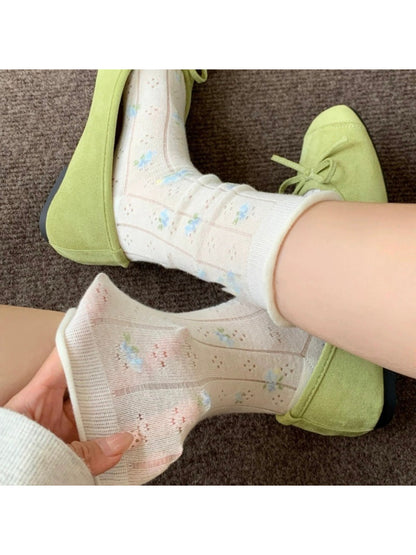 WHTFLW Rufia floral crew socks styled with flats