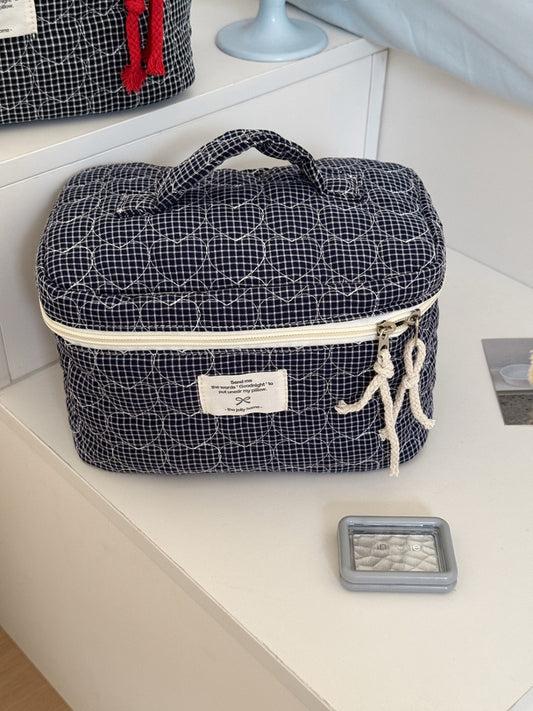 Open view of Cosbai makeup storage case showing organized grid with cosmetics inside