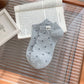 Side view of Rufia Everyday Polka Dot Socks highlighting ankle length and pattern