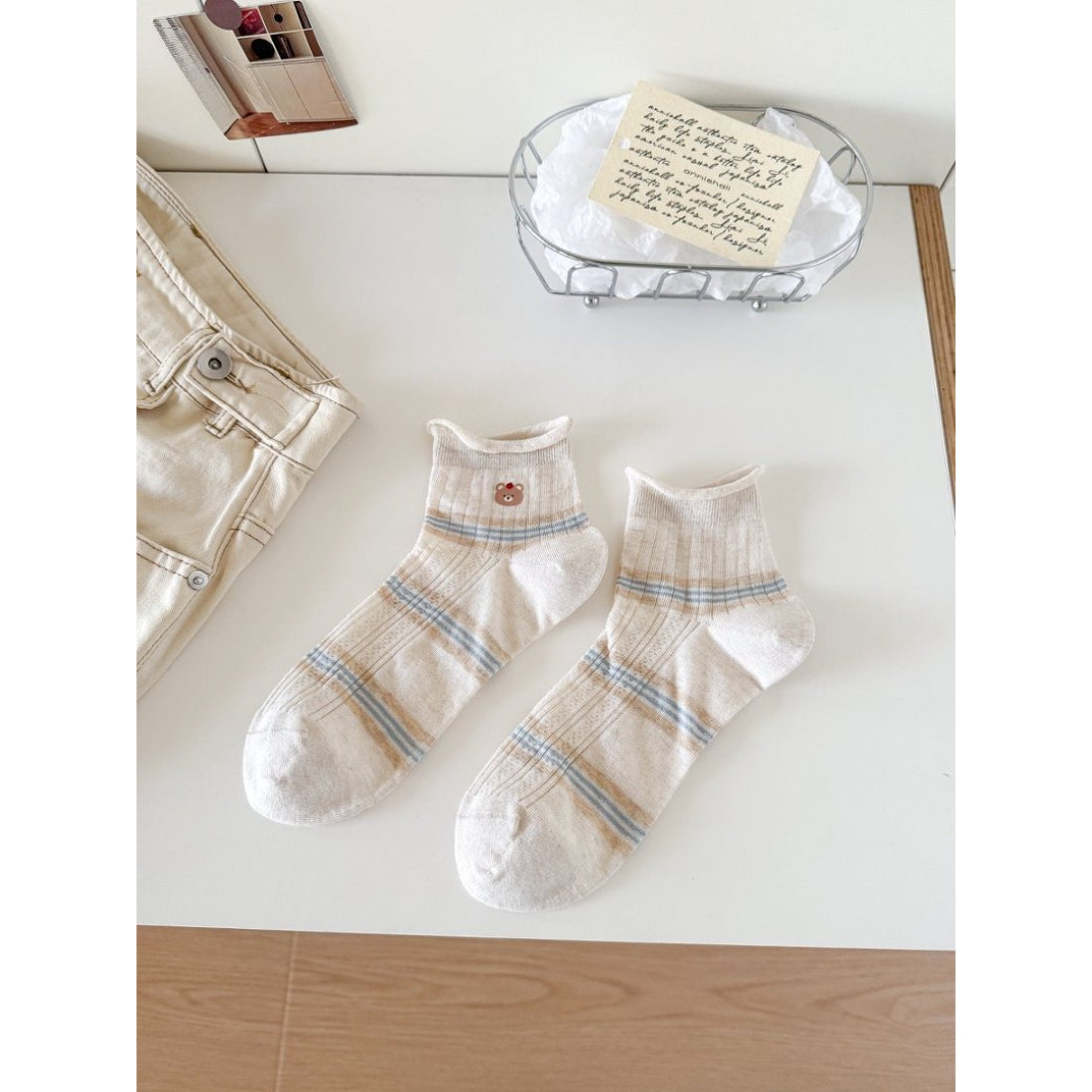 Model wearing Rufia Cute Bear Stripe Crew Socks paired with casual shoes