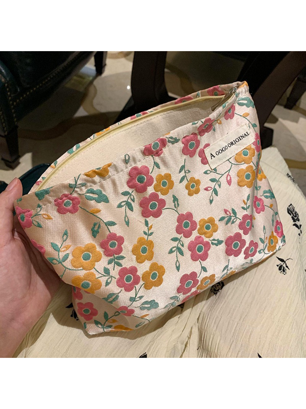 Cosbai 70s inspired floral makeup pouch with colorful flower pattern on fabric