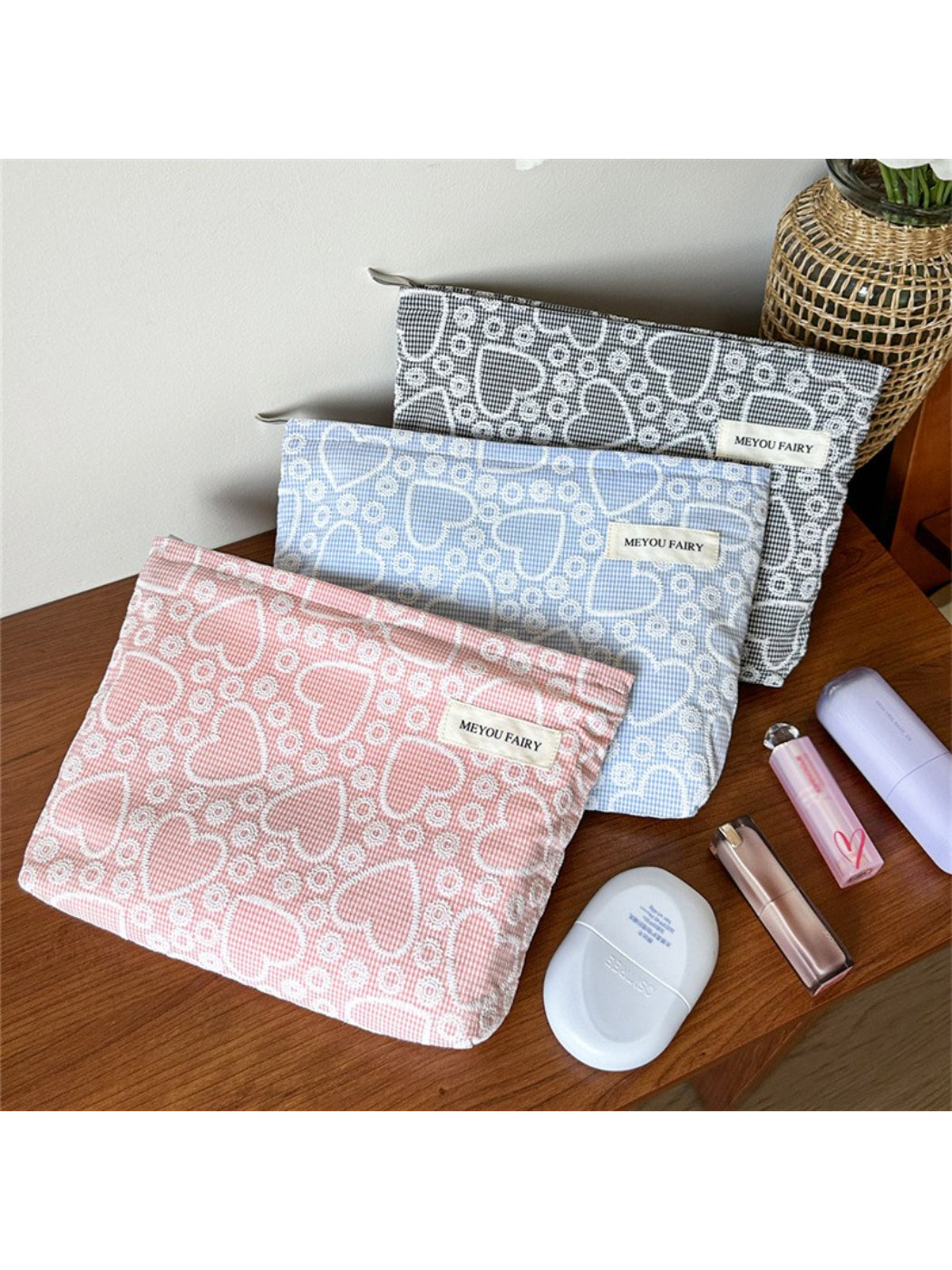 Cosbai makeup bag with pink heart pattern on white background, rectangular shape