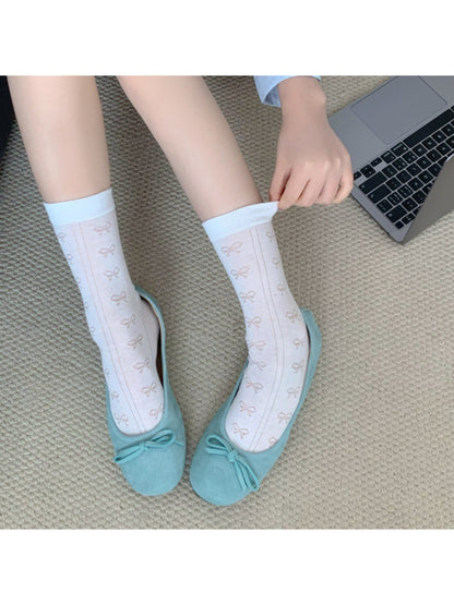 Pair of Rufia Ribbon Stripe Sheer Socks displayed flat on white background