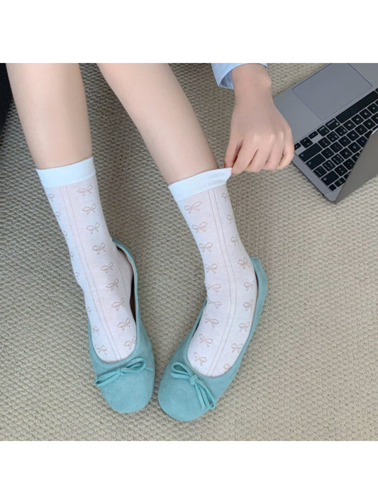 Pair of Rufia Ribbon Stripe Sheer Socks displayed flat on white background