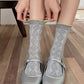 Rufia lace white mid-calf socks displayed with lace pattern and sock shape clear