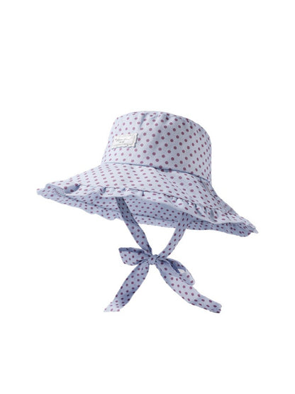 Close-up of Haila hat fabric texture and polka dot design