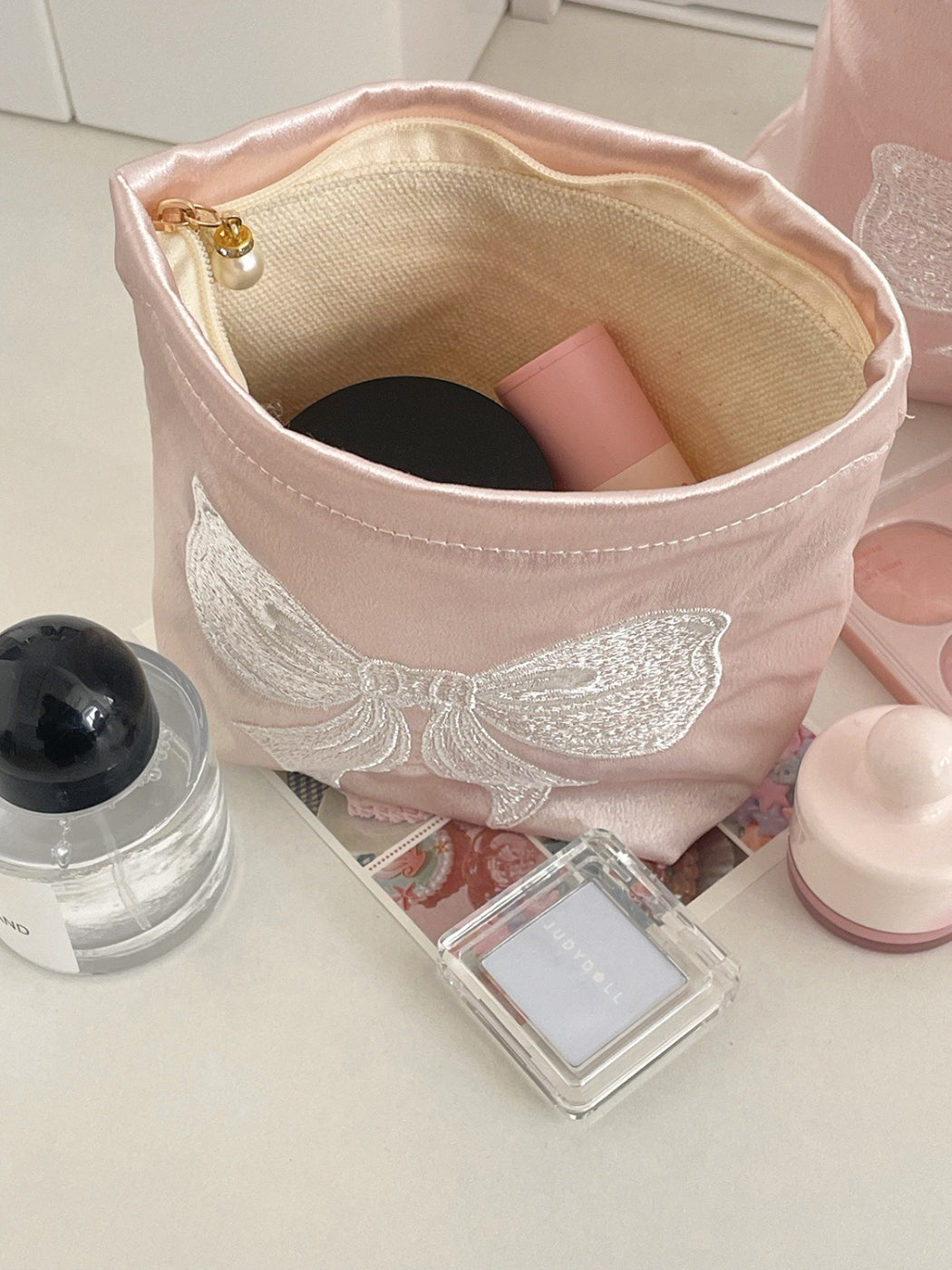 Cosbai cosmetic pouch shown folded flat for easy storage and travel