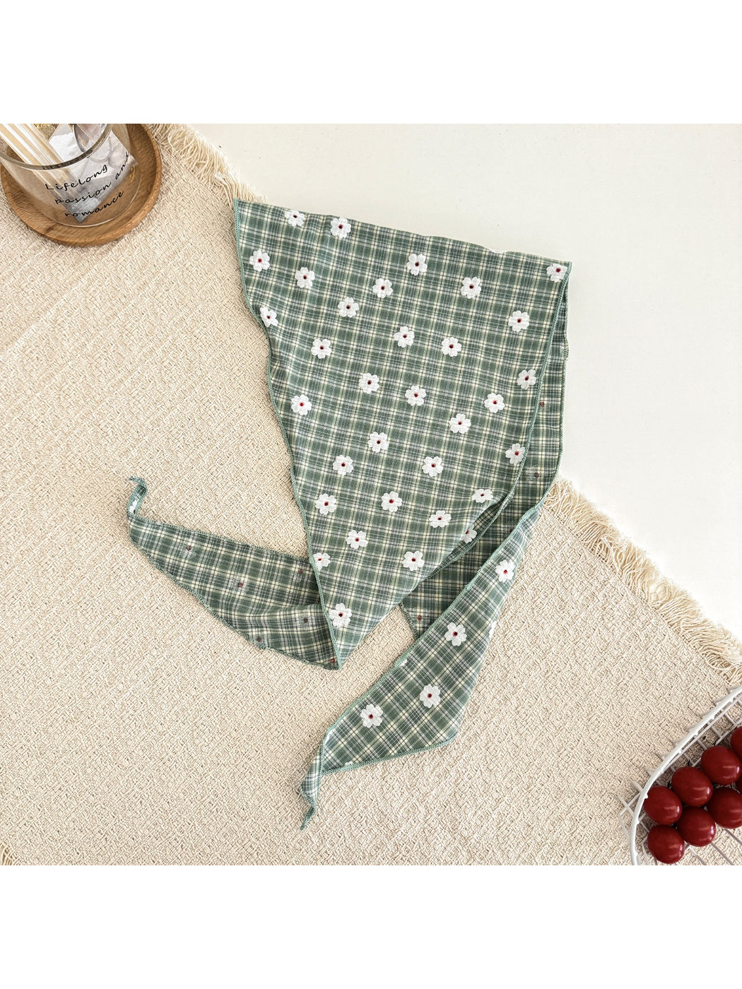 Flat lay of soft plaid daisy hair tie scarf showing fabric texture and pattern