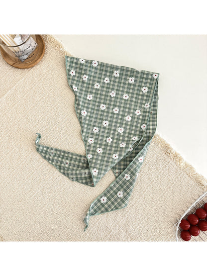 Flat lay of soft plaid daisy hair tie scarf showing fabric texture and pattern