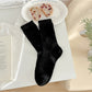Rufia neutral textured crew socks arranged in a fan shape displaying texture
