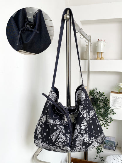 Interior view of Cosbai reversible shoulder bag showing lining and pocket