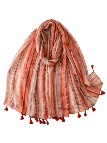 Orange Red scarf with lengthwise stripes, geometric diamond motifs and tasselled ends, looped display