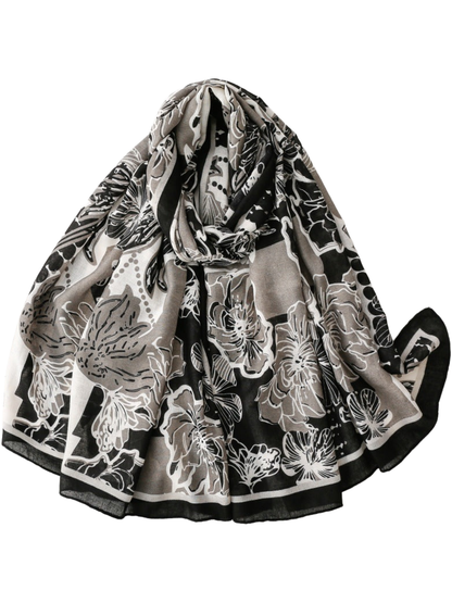 Black Gray floral scarf with a black border, loosely looped and draped