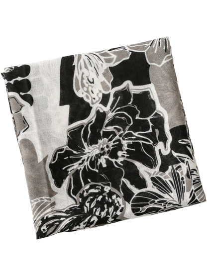 Floral scarf folded into a square, showing a large outlined flower