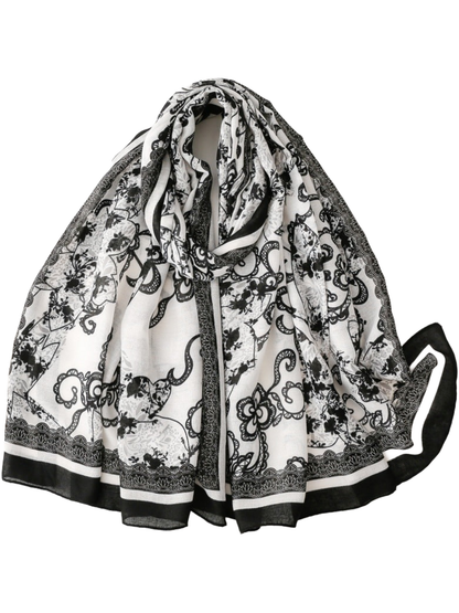 Black / White / Gray floral scarf arranged in a broad loop with contrasting borders