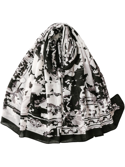 Black floral and abstract print scarf with a broad black border, draped view