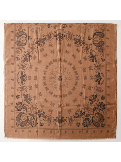 Scarf laid flat with paisley and floral motifs and short fringed edges