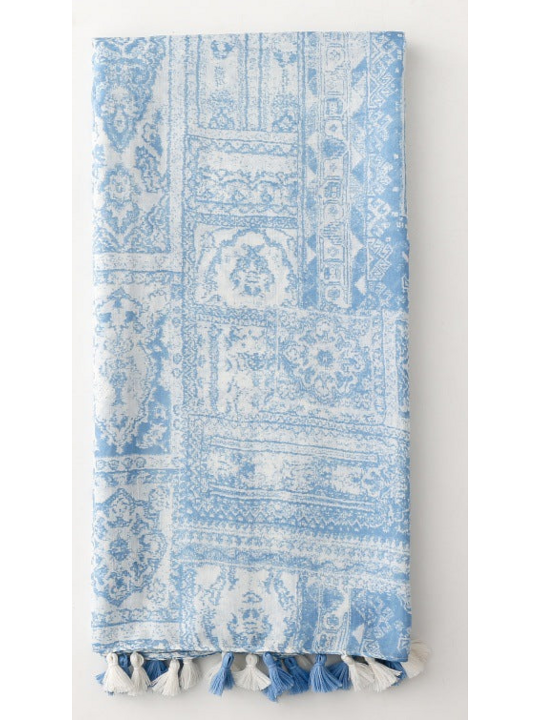Blue and white scarf folded lengthwise with tassels along the bottom