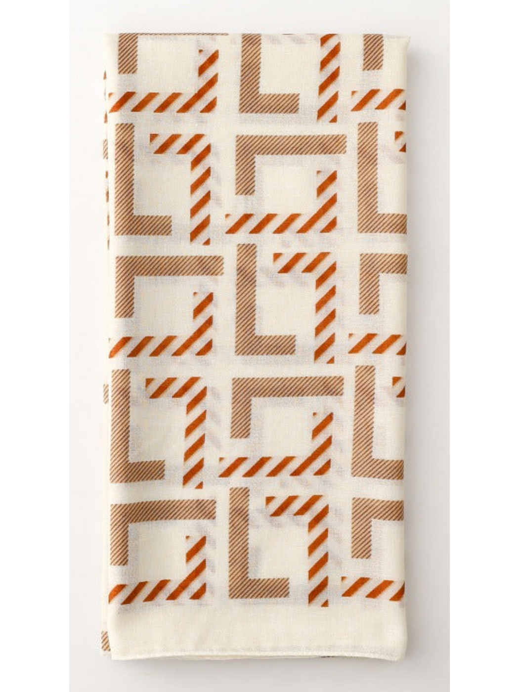 Geometric scarf folded lengthwise with repeating angular motifs