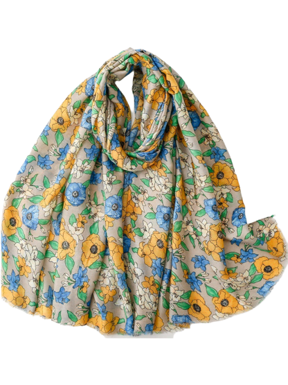 Blue floral scarf with fringed edges in a looped display