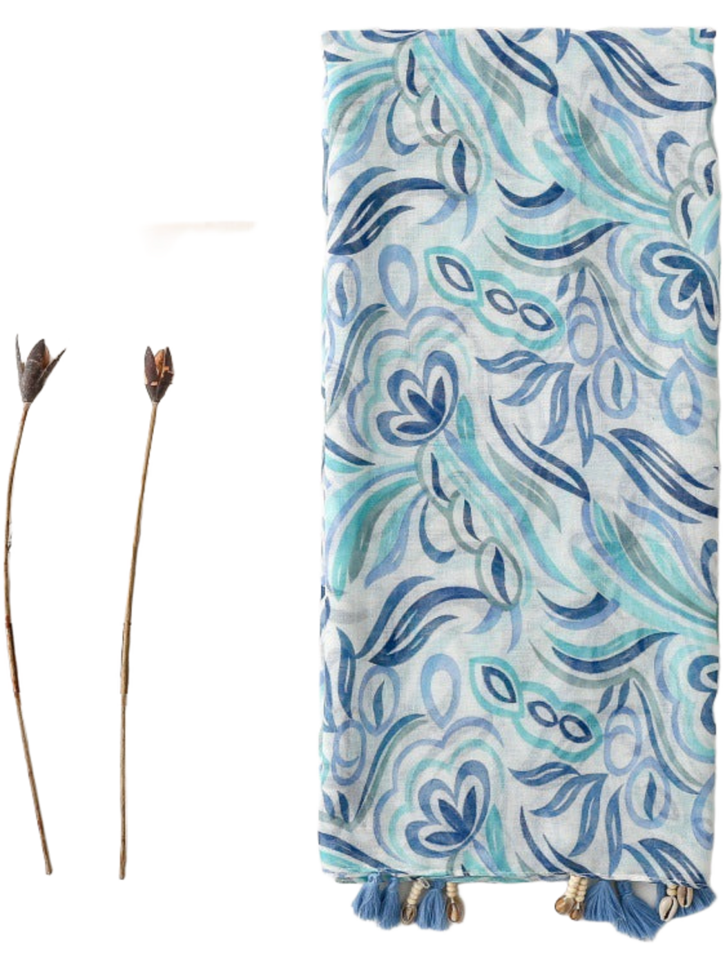Blue scarf folded lengthwise, showing floral and leaf motifs and tasseled trim