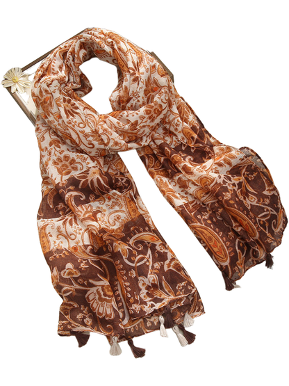 Brown paisley and floral scarf with contrasting patterned panels and tassel trim, looped display