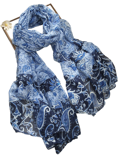 Blue paisley and floral scarf with contrasting navy panels, looped display