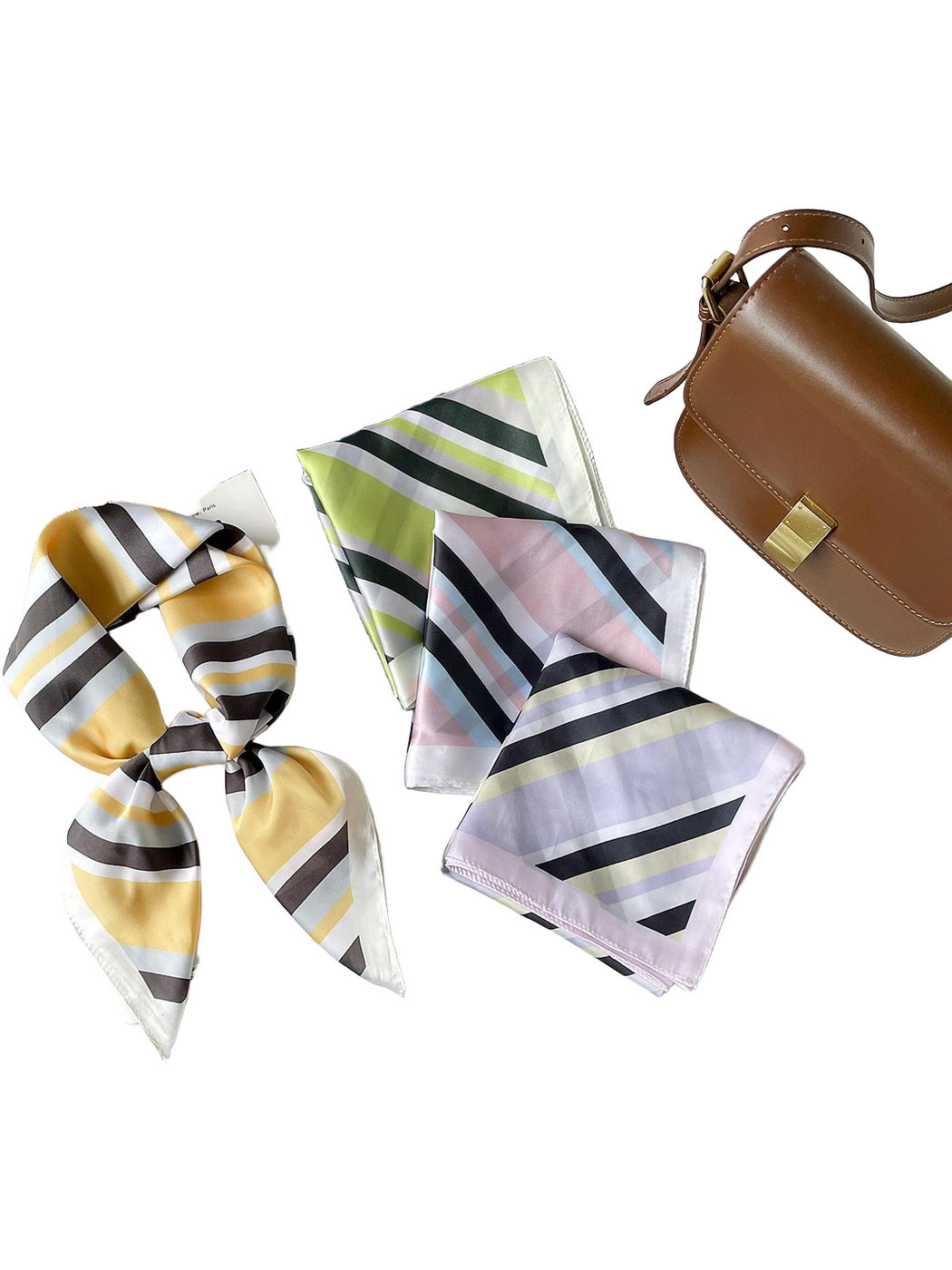 Four striped scarf colors displayed together, with Yellow knotted and Green, Pink and Purple folded