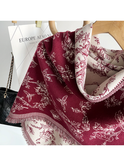 Burgundy floral scarf close-up showing cream reverse, striped border and fringe
