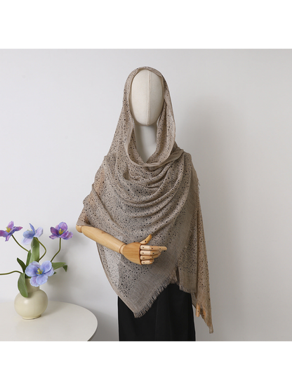 Khaki openwork scarf with fringed edges draped over a mannequin