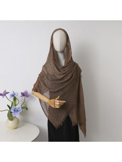 Coffee openwork scarf with fringed edges draped over a mannequin