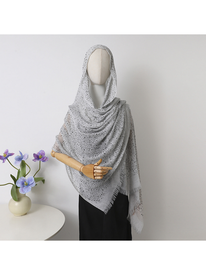 Light Gray openwork scarf with fringed edges draped over a mannequin