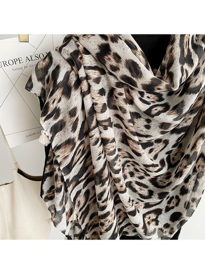 Close-up of Multicolor leopard-print scarf folds and tassels