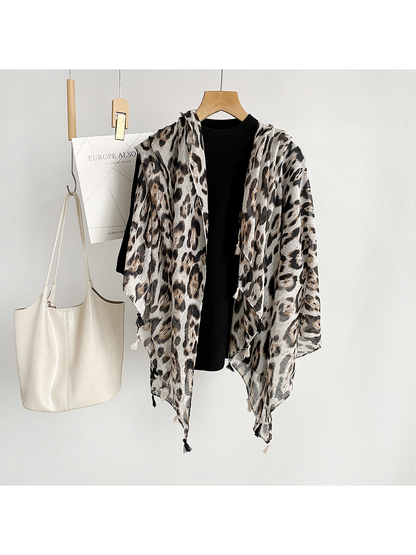 Multicolor leopard-print scarf hanging open over a black top