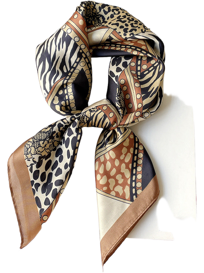 Orange animal-print scarf arranged in a knotted loop with contrasting border