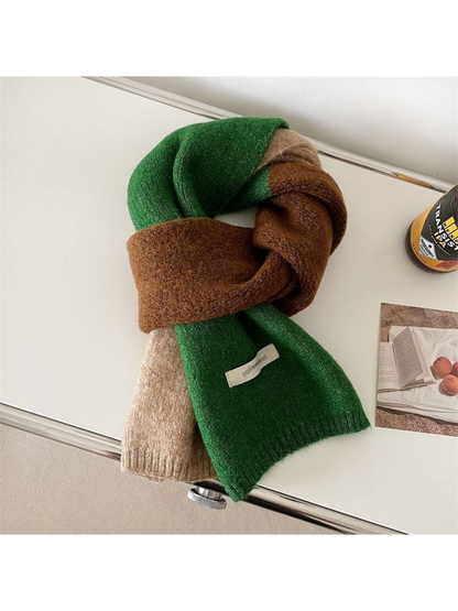Green color-block scarf with brown and beige sections, looped on a tabletop