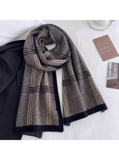 Black plaid scarf looped over a dark garment, with both ends extended