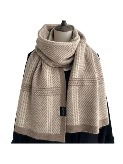 Beige plaid scarf with taupe borders draped on a mannequin