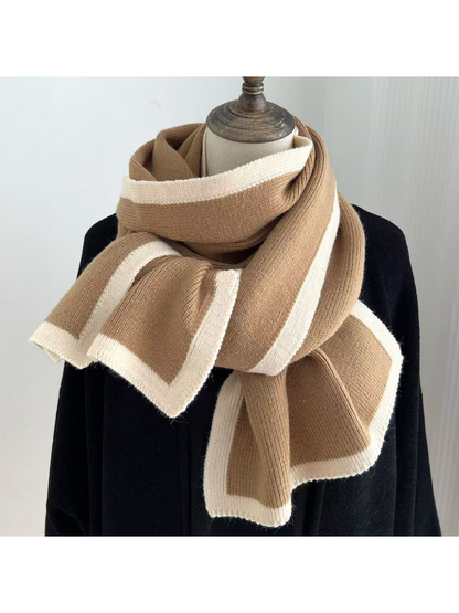 Camel knit scarf with cream border stripes draped around a mannequin