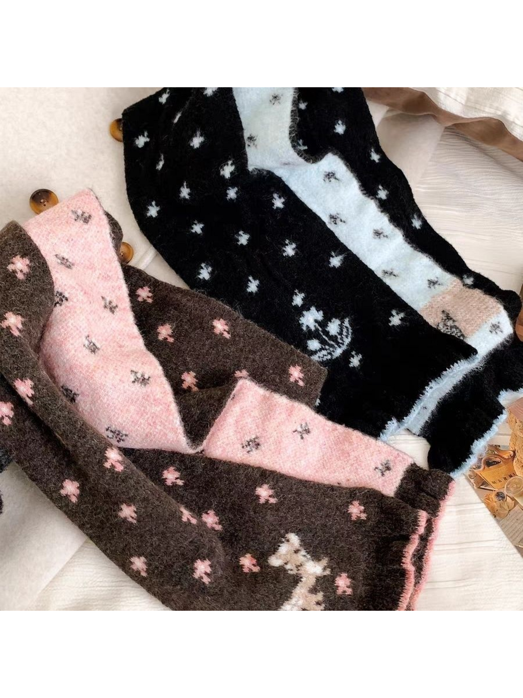 Brown and Black scarves showing contrasting reverse colors and floral motifs