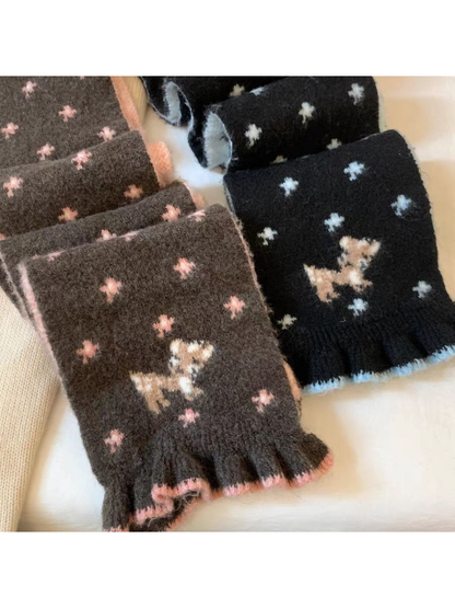 Brown and Black scarf ends with deer motifs and contrasting ruffled edging