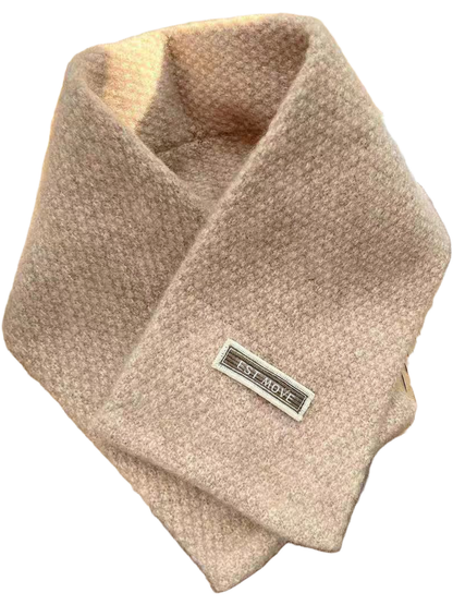 Beige textured crossover scarf with attached rectangular label