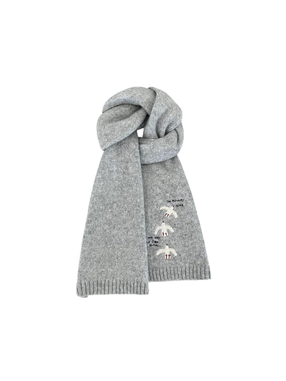 Gray knit scarf looped upright, with bird embroidery and ribbed ends