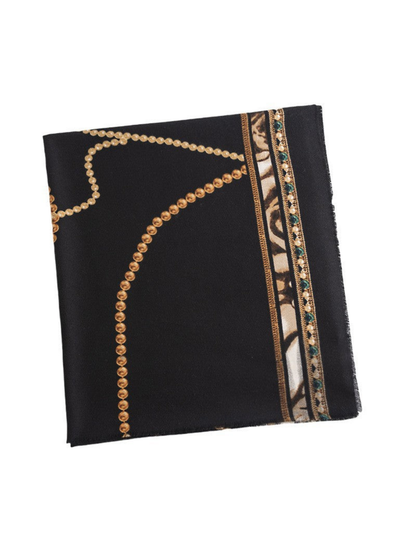 Black scarf folded flat, showing curved gold-tone bead-chain motifs and a cream and green ornamental border