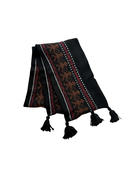 Black scarf folded to show brown deer motifs, burgundy geometric bands and four black corner tassels