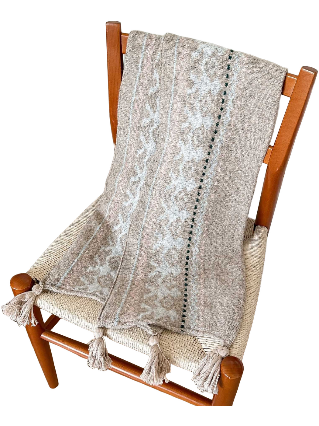Beige scarf with pale blue deer motifs, a dark green dotted line and corner tassels, draped over a chair