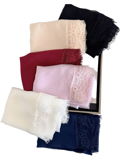 Folded scarves in Black, Cream, Burgundy, Pink, White and Navy showing lace borders