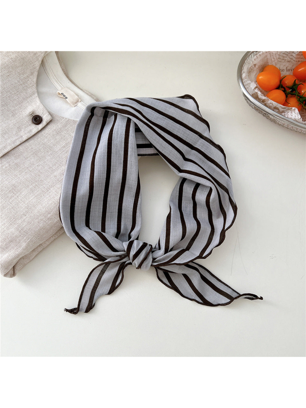 Gray Single Stripes triangle scarf tied in a loop