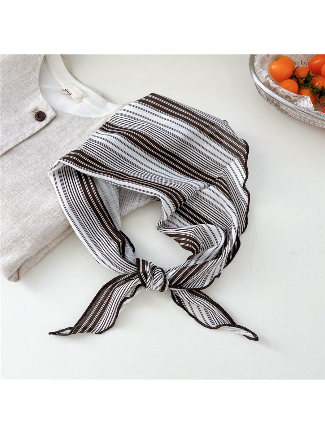 Ivory Grouped Stripes triangle scarf tied in a loop